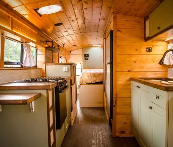 Interim wooden design in the PTP School Bus Conversion. Natural colours, mint green cupboards, and a real homely vibe