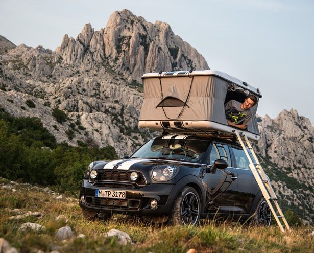 Man sitting in rooftop tent