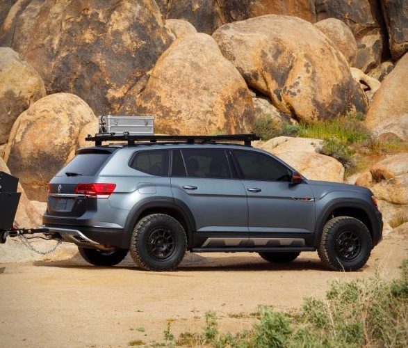 VW Atlas Basecamp side on travelling through rocky terrain