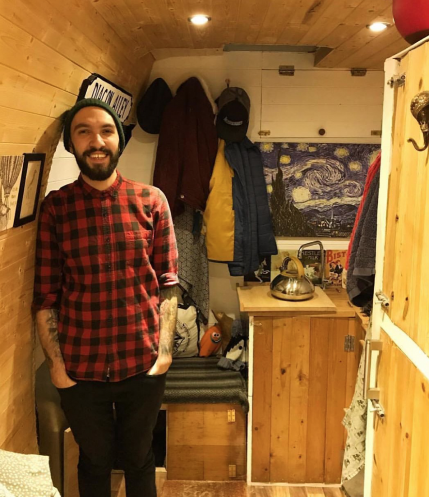 is van life legal - Seb from Vincent Vanlife stood in his full time home - a Vauxhall Movano Camper