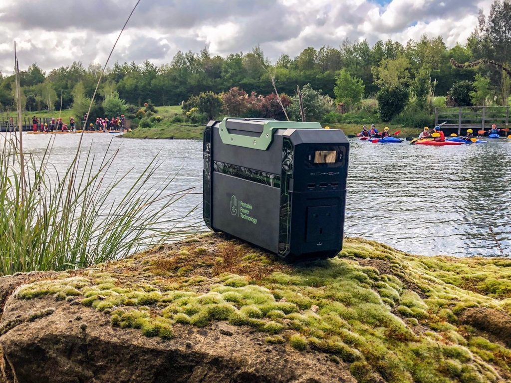portable power pack on a rock near a water sports class