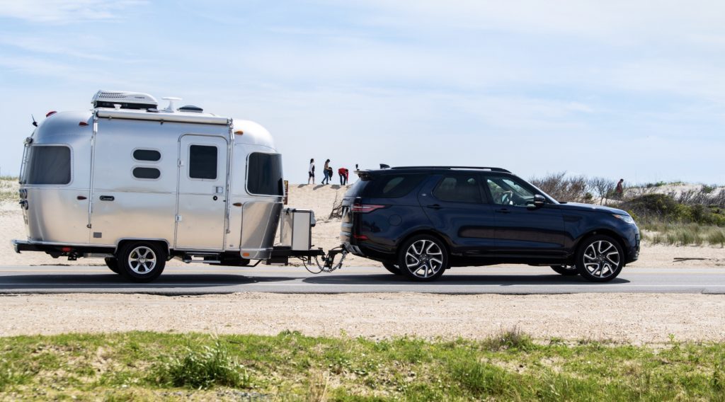 Best RV - exterior of Airstream Caravel attached to a car 