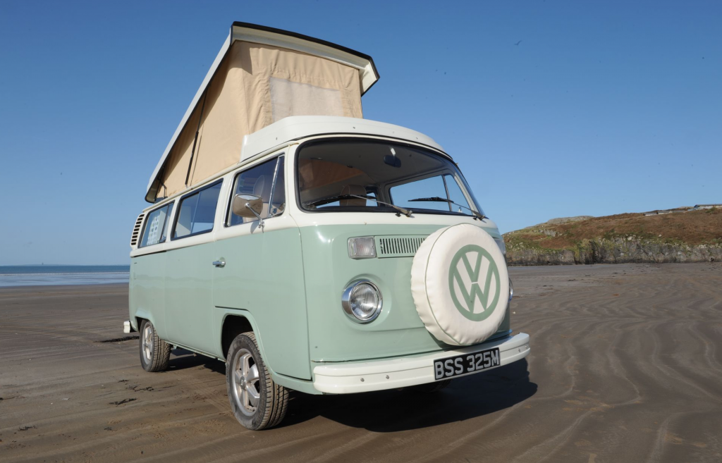 Best RV - mint green exterior of VW bus with pop top up