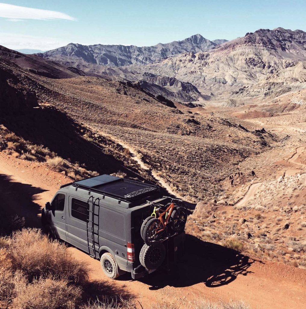 Sportsmobile Campers - Sprinter conversion on dirt road in mountains. 