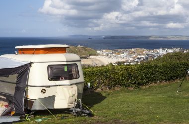 Best Campervan Campsites UK- Trailer overlooking sea 
