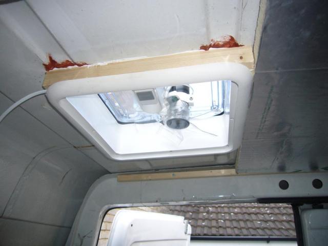 camper van windows - a roof vent half installed