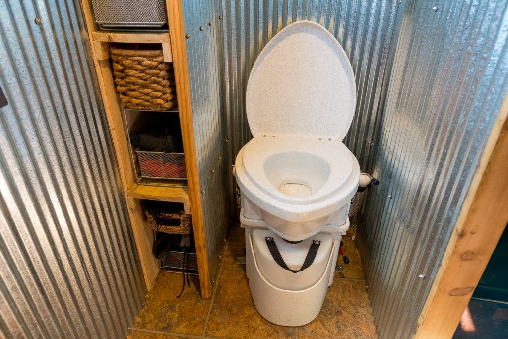 Natures Head Composting toilet - white, installed in a off grid hut