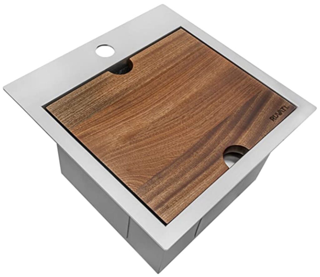 Sink with chopping board on top 