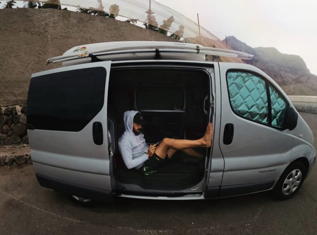 Van dwelling - man in van in car park 