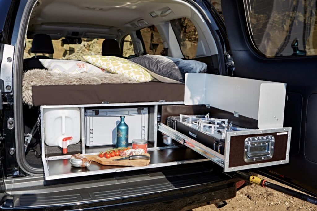 SUV camper conversion kit - Kitchen extended in back of car 