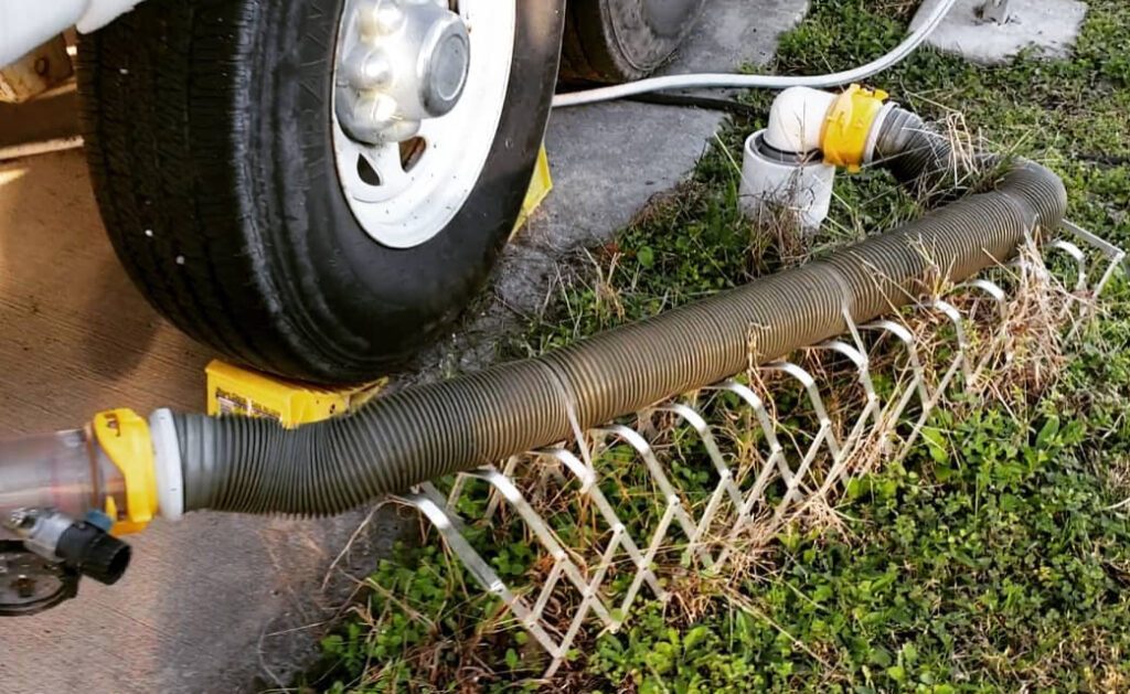 RV sewer hose on raised holders