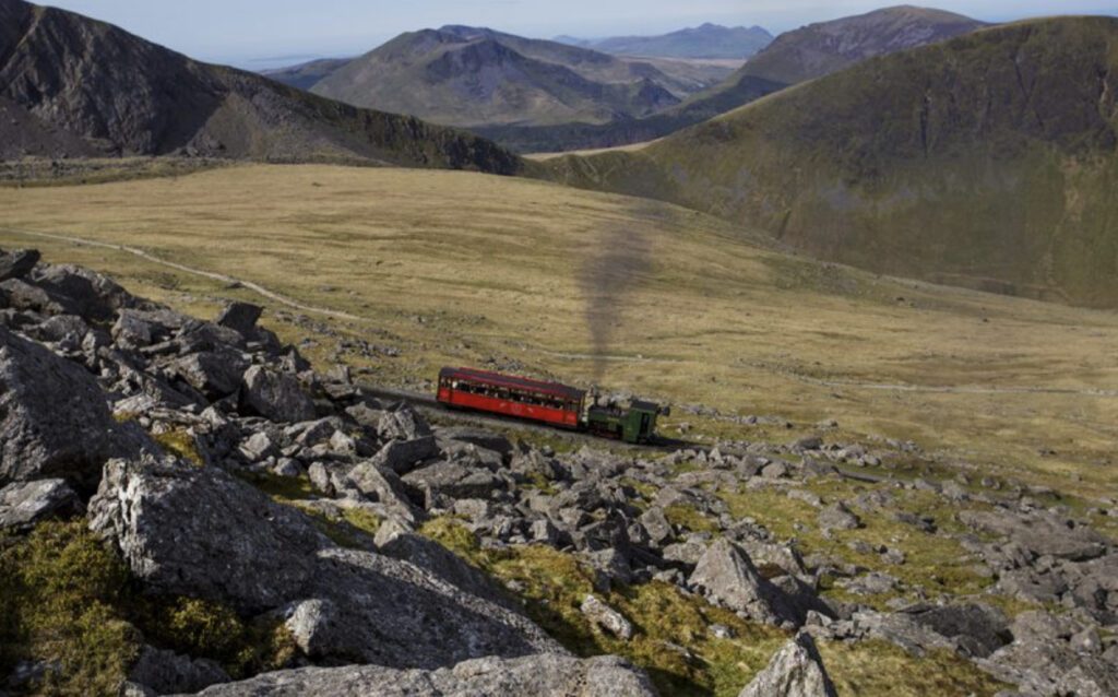 Places to visit in UK  - train going up Mount Snowdon 